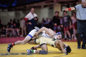 New Rochelle's Matteo Crino controls Clarkstown's Alex Perez during the Section 1 Championships on Feb. 8. Crino won his first-ever sectional title on Sunday.